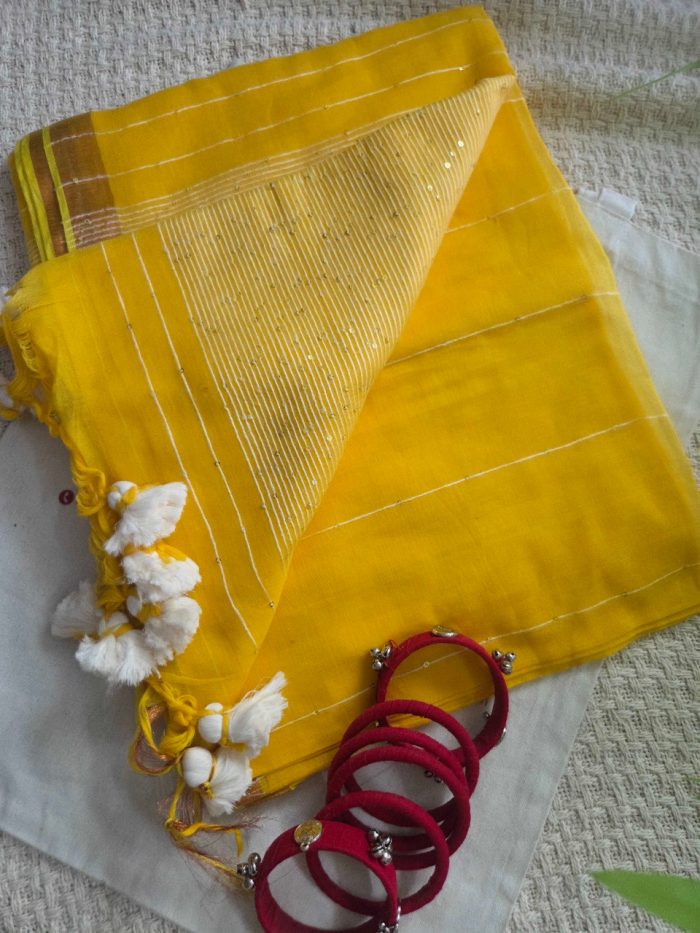 Vibrant Yellow Mul Mul Cotton Saree with Sequence Detailing.